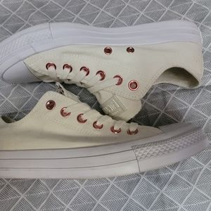 Off white Converse with pink metallic details